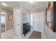Welcoming entryway featuring tiled floors, natural light, and a convenient shoe storage cabinet at 2384 E Santiago Trl, Casa Grande, AZ 85194