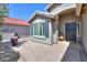 Charming front patio offers an inviting entrance with desert landscaping and a gray painted exterior at 2384 E Santiago Trl, Casa Grande, AZ 85194