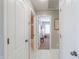 Hallway with views into a bedroom and bathroom that features decorative doors at 2384 E Santiago Trl, Casa Grande, AZ 85194
