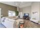 Bright living room with a large sofa, high ceilings, and stylish decor at 2384 E Santiago Trl, Casa Grande, AZ 85194