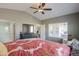 Bright main bedroom with view to backyard; features en-suite bathroom and walk-in closet at 2384 E Santiago Trl, Casa Grande, AZ 85194