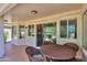 Cozy back patio with wicker seating area with sliders to interior at 2464 E Hancock Trl, Casa Grande, AZ 85194