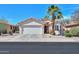 Charming single-story home featuring desert landscaping, a two-car garage, and a welcoming front entrance with mature landscaping at 2464 E Hancock Trl, Casa Grande, AZ 85194