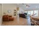 Open-concept living room with neutral walls, recessed lighting, and access to the outdoor space at 2464 E Hancock Trl, Casa Grande, AZ 85194