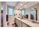Bathroom features granite countertops, double sinks, and a large mirror at 25920 W Westcott Dr, Buckeye, AZ 85396