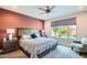 Cozy bedroom with a large window and comfortable furnishings, offering a relaxing retreat at 25920 W Westcott Dr, Buckeye, AZ 85396