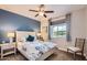 Comfortable bedroom with a large window and stylish furniture at 25920 W Westcott Dr, Buckeye, AZ 85396
