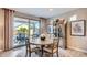 Bright dining area with sliding glass doors leading to an outdoor patio at 25920 W Westcott Dr, Buckeye, AZ 85396
