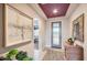 Inviting entryway featuring stylish decor, tile flooring, and plenty of natural light at 25920 W Westcott Dr, Buckeye, AZ 85396