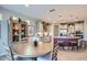 Bright kitchen and dining area with stainless steel appliances and modern decor at 25920 W Westcott Dr, Buckeye, AZ 85396