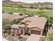 Aerial view of a well-maintained house and golf course with mature trees and landscaping at 27688 N 125Th Dr, Peoria, AZ 85383