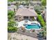 Aerial view showcasing the backyard pool, spa, outdoor kitchen, and patio at 27688 N 125Th Dr, Peoria, AZ 85383
