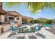Luxurious backyard featuring a built-in grill, fire pit and sparkling pool at 27688 N 125Th Dr, Peoria, AZ 85383