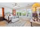 Elegant bedroom with a decorative bed frame, hardwood floors, natural light and ceiling fan at 27688 N 125Th Dr, Peoria, AZ 85383