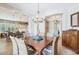 Bright dining area connecting to the kitchen, showcasing a spacious and open layout at 27688 N 125Th Dr, Peoria, AZ 85383