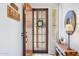 Inviting entryway featuring a decorative front door, modern decor, and neutral colors at 27688 N 125Th Dr, Peoria, AZ 85383