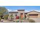 Charming front exterior with stone accents, desert landscaping, and a cozy design at 27688 N 125Th Dr, Peoria, AZ 85383