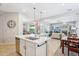 Bright kitchen featuring a large center island, stainless steel appliances and pendant lighting at 27688 N 125Th Dr, Peoria, AZ 85383