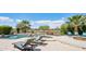 Beautiful pool and spa area with manicured landscaping and lounge chairs at 27688 N 125Th Dr, Peoria, AZ 85383