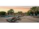 Stunning outdoor pool and spa area with lounge chairs and lush landscaping at 27688 N 125Th Dr, Peoria, AZ 85383