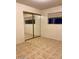 The bedroom features tile flooring, a mirror sliding door closet, and a window at 3339 W Shaw Butte Dr, Phoenix, AZ 85029