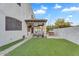 An outdoor living space with a covered patio, BBQ, and well manicured lawn at 3675 N 59Th Pl, Phoenix, AZ 85018