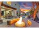 Expansive backyard featuring a custom fire pit, a built-in grill, and a sparkling pool with desert views at 3675 N 59Th Pl, Phoenix, AZ 85018