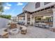 Beautiful backyard featuring an outdoor kitchen, cozy seating, and a lush lawn with a play set, perfect for Gathering enjoyment at 3675 N 59Th Pl, Phoenix, AZ 85018