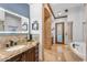 Bright bathroom features tub, granite countertops, vanity and accent lighting at 3675 N 59Th Pl, Phoenix, AZ 85018