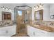 Bright bathroom with dual vanities, granite countertops and a walk-in shower at 3675 N 59Th Pl, Phoenix, AZ 85018