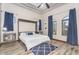 Bedroom features a Murphy bed, windows with view, and blue accent rug at 3675 N 59Th Pl, Phoenix, AZ 85018