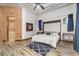 Bedroom features a Murphy bed, en-suite bathroom, and blue accent rug at 3675 N 59Th Pl, Phoenix, AZ 85018