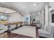 Upstairs game room with a shuffleboard table, lounge seating, and stylish decor at 3675 N 59Th Pl, Phoenix, AZ 85018