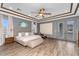 Serene main bedroom features a tray ceiling, and private access to a patio at 3675 N 59Th Pl, Phoenix, AZ 85018