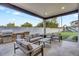 Stylish outdoor living area with a built-in grill and bar, perfect for entertaining and enjoying the backyard at 3675 N 59Th Pl, Phoenix, AZ 85018
