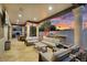 Relaxing outdoor space with covered patio, comfortable seating, a built-in barbecue, and cozy fire pit at 3675 N 59Th Pl, Phoenix, AZ 85018