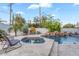 Inviting backyard pool and spa surrounded by lush landscaping and lounge chairs at 3675 N 59Th Pl, Phoenix, AZ 85018