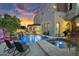 Relaxing backyard pool and spa with waterfall features and comfortable lounge seating at 3675 N 59Th Pl, Phoenix, AZ 85018