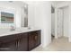 Bathroom featuring double vanity, tile flooring, and a large mirror at 37215 W Patterson St, Maricopa, AZ 85138