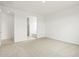 Spacious bedroom featuring plush carpet and an open doorway to the bathroom at 37215 W Patterson St, Maricopa, AZ 85138
