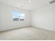Bright and airy bedroom with plush carpet and a view-filled window at 37215 W Patterson St, Maricopa, AZ 85138
