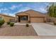 Charming single-story home with neutral stucco, low-maintenance landscaping, and attached two-car garage at 37384 W Prado St, Maricopa, AZ 85138