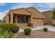 Charming single-story home with neutral stucco, low-maintenance landscaping, and attached two-car garage at 37384 W Prado St, Maricopa, AZ 85138