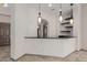 Wet bar featuring pendant lighting, dark countertops, and backsplash at 3816 E Expedition Way, Phoenix, AZ 85050