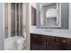 Bathroom featuring updated vanity with marble countertop, and a modern shower and tub at 3816 E Expedition Way, Phoenix, AZ 85050