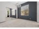 Bedroom with a modern light fixture, neutral walls, and mirrored closet doors at 3816 E Expedition Way, Phoenix, AZ 85050