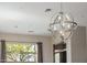 A view of a dining room featuring a modern chandelier that is above the dining room table at 3816 E Expedition Way, Phoenix, AZ 85050
