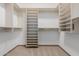 This closet features custom shelving and hanging rods at 3816 E Expedition Way, Phoenix, AZ 85050