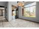 Dining room showcasing backyard access through sliding glass doors and large windows at 3816 E Expedition Way, Phoenix, AZ 85050