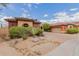 Beautiful desert-landscaped home with a red-tiled roof, colorful exterior, and an attached garage at 3816 E Expedition Way, Phoenix, AZ 85050